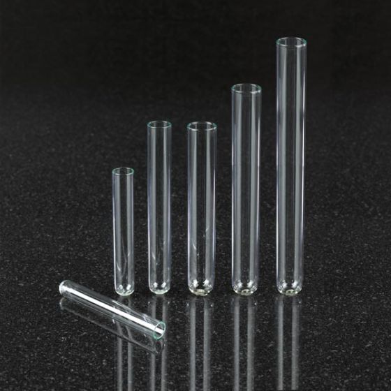 Laboratory glass test tubes in test tubes rack and chemical vials